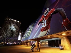Building wraps on the Mercedes-Benz Superdome and Benson Tower for Super Bowl XLVII (AP Photo/Dave Martin)