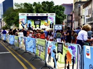 Mesh stage scrim, banners, and backdrop and barricade covers